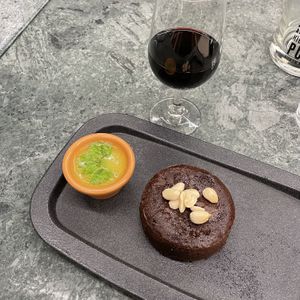 Fudgy chocolate cake with a glass of port wine  at The Green Affair - Chiado in Lisbon