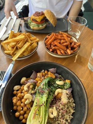 Buddha bowl and cascáis burger. The sweet potato fries are a must!!  at The Green Affair - Chiado in Lisbon