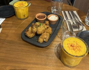 Cauliflower wings & mango and turmeric mocktail!  at The Green Affair - Chiado in Lisbon