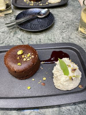 chocolate cake with whipped cream (coconut) and some berry glaze  at The Green Affair - Chiado in Lisbon