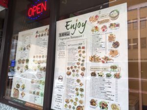 menu in the window at Enjoy Vegetarian - Financial District in San Francisco