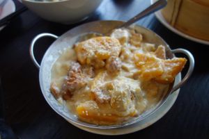 I think this is a dish of Taro, Gluten Puff and pumpkin in coconut sauce.  It was yummy.  The sauce was creamy but not spicy.  It went nicely with the spicy dishes on our table.   at Enjoy Vegetarian - Financial District in San Francisco