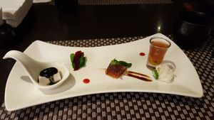 This course has tiny bite-sized tasting bits. The right is a cup of passion fruit with vinegar, next to chinese yam. The left is tofu with sesame. at Yangming Spring - 陽明春天蔬食 in Taipei