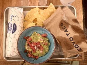 Plain rain Burrtio, Guac + Chips  at Coyo Taco in Miami