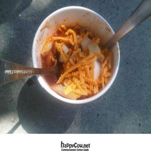 Italian sausage dog topped with sauerkraut and mustard at City Dogs - Food Cart in Salt Lake City