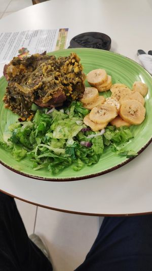 Baked sweet potato, ackee, callaloo, plantain and salad at SoulFoods Farmacy in East London
