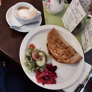 Flatbread, it was delicious. Very adaptable. They mark df, v, gf on the menu and happily substitute things.  at The Wild Flour in Newtonmore
