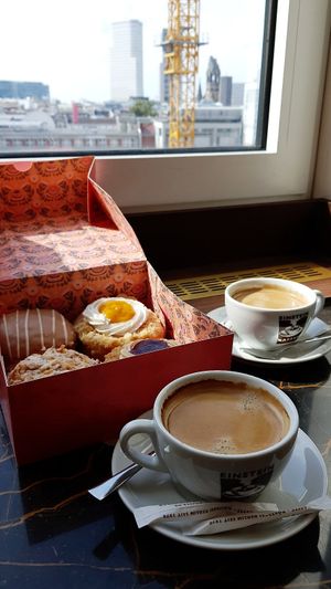 Donuts-to-go with coffee at Einstein Kaffee at Brammibal's Donuts - KaDeWe in Berlin