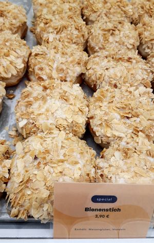 donut "Bienenstich" (almond, vanille pudding) at Brammibal's Donuts - KaDeWe in Berlin