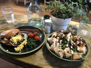 Bagel with tofu scramble and ceasar salad  at Lilith's  in Cheltenham