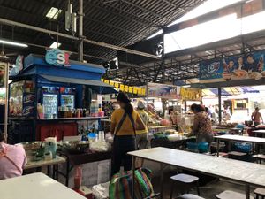 Look for the yellow flags with the red "17" symbol on them. at Chalawan - Vegan Food Stall in Bangkok