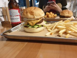 Ontario burger with fries and extra burger sauce. Burger in the back is a custom build cheese burger. at Great Lakes in Tokyo