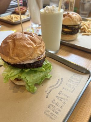 Ontario burger in the front and a piña colada shake  at Great Lakes in Tokyo