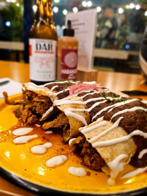 Chilaquiles con chirizo y orellanas apanadas at Dalia Plant Power Mex in Bogota