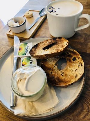 Bagel with vegan cream cheese and Whitby fog with oat milk.   at Mr Cooper's Coffee House in Whitby