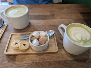 Matcha Latte - biscuits also vegan! at Mr Cooper's Coffee House in Whitby