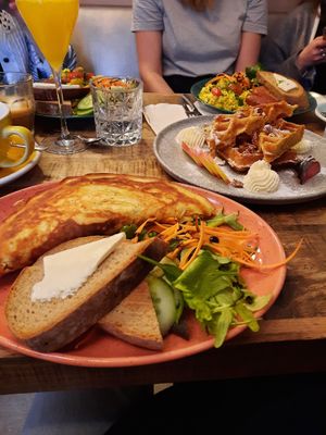 kimchi omlette (front), maple waffles and vegan scrambled egg at Palo Verde in Prague