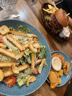 Chicken Caesar, with empanada and popcorn chicken appetizers   at Palo Verde in Prague