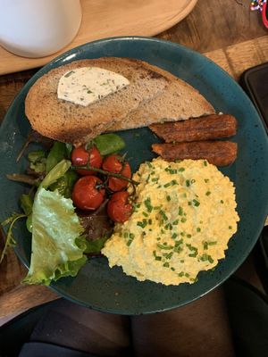 scrambled tofu eggs, sausage, bread and salat  at Palo Verde in Prague