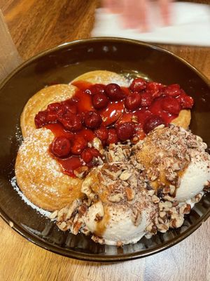 Pancakes with hot cherries and Oatly soft serve   at Palo Verde in Prague