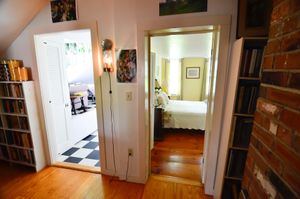 Upstairs Apartment is a charming space with light filled niches and fantastic views out the windows and off the balcony.  at Flower Hill Farm Retreat  in Williamsburg