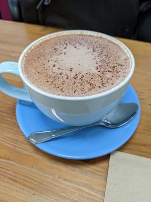 Hot chocolate with oat milk at Embrace Cafe in North London