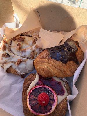 bourbon pecan cinnamon roll, orange raspberry danish, & pain au chocolate at Terms of Endearment in Brooklyn