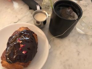 Pain au chocolat, tea with  oat milk  at Terms of Endearment in Brooklyn