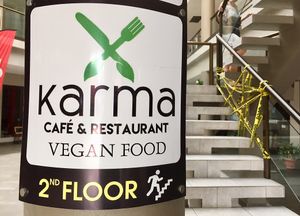 Sign out front showing direction  at Karma in Jaco