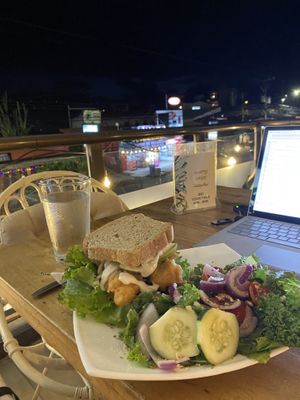 Tofu sandwich is AMAZING. (And huge!😄) not long after sunset  at Karma in Jaco