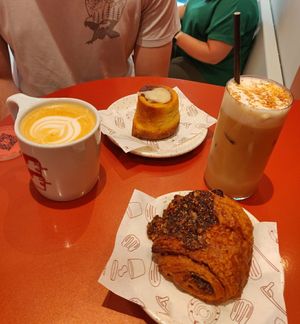 Chocolate roll, cinnamon roll and coffee at Buddy Buddy in Brussels