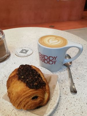 Cappuccino with pain au chocolat at Buddy Buddy in Brussels