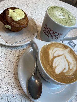 Peanut butter matcha, cinnamon bun and flat white   at Buddy Buddy in Brussels