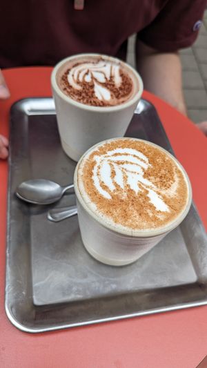 Special coffees - almond chai and a buttery chocolate option at Buddy Buddy in Brussels