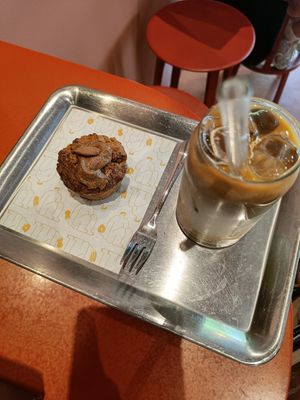 Decaf iced peanut butter coffee and coconut carrot cake at Buddy Buddy in Brussels