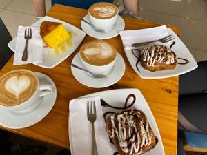 Coffee with coconut milk, passion fruit cake and cinnamon rolls at Café Monteverde in Monteverde