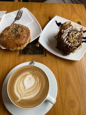 Potato empanada, vegan cinnamon roll, and coconut milk latte.  at Café Monteverde in Monteverde