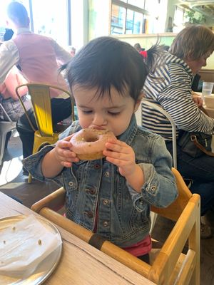 She loves the donuts!! at Back To Eden Bakery in Portland