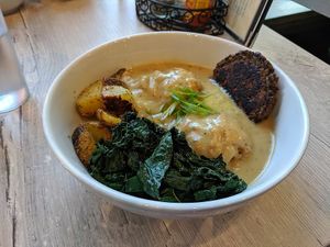 Biscuits and Gravy Bowl with potatoes, sausage patty, kale. at Back To Eden Bakery in Portland