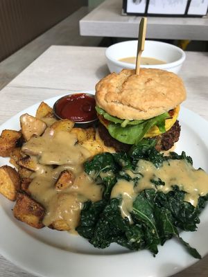 Breakfast sandwich with gravy on the sides at Back To Eden Bakery in Portland