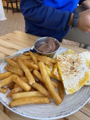 Kids quesadilla with fries, pudding and a drink at Veggie Grill by Next Level - W 23rd in New York City