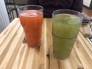 Amazing dispenser juices on offer - strawberry and lime mint lemonade left to right at Veggie Grill by Next Level - W 23rd in New York City