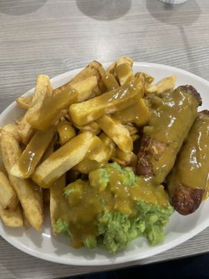Vegan battered sausages, vegan chips, vegan mushy peas and vegan curry sauce    at Captain Cod in Boston