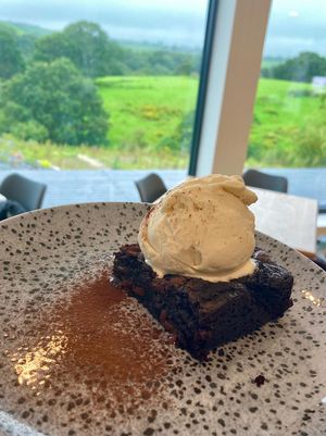 Vegan hocolate brownie with vanilla ice cream 🍦  at Whins Kitchen in Wheelton