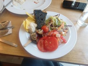 Little bit of everything from the lunch menu. Spinach pie, white bean dip with chips, eggplant skewers and 3 salads. Also served with a potato coconut soup.  at DaTerra - Parque das Nações in Lisbon