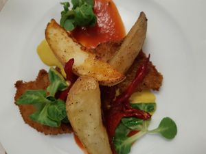 filete de proteinas rebozado con dos salsas y patatas at L'Encant Vegetaria in Barcelona