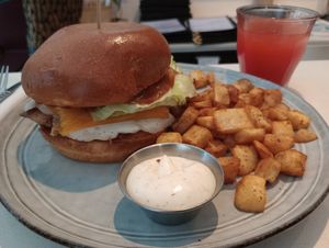 Breakfast sandwich with potatoes, fresh juice of the day (watermelon + pineapple) at Archway Verdun in Montreal