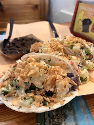 Jerk cauliflower tacos, topped with crunchy onions and pineapples!   at Yellow Dog Eats in New Smyrna Beach