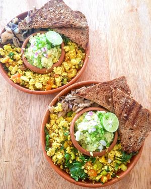 Tofu scramble bowl with avocado spread and garlic bread  at The Native in Weligama