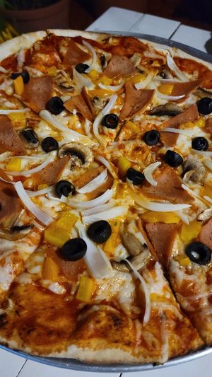 Brick oven pizza at Changomango in Merida